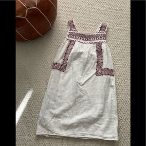 White dress with red detailing